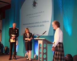 Jacqui James collecting the award on behalf of Salisbury & District Walking for Health, Jane Scott OBE, Leader of Wiltshire Council and John Bush OBE, Lord Lieutenant of Wiltshire